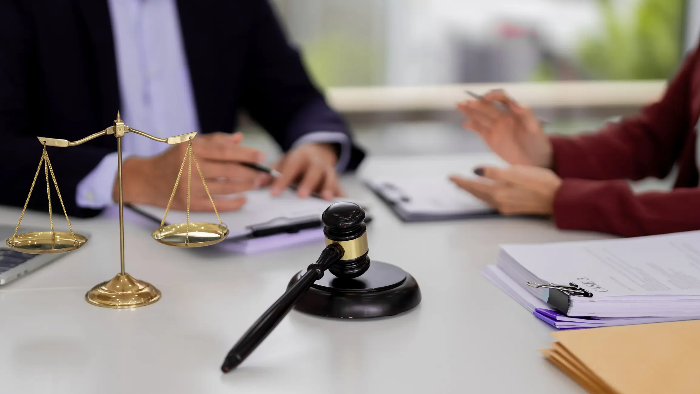 Lawyers meet clients discuss legal cases office setting professional environment justice symbols present expert guidance offered for dispute resolution