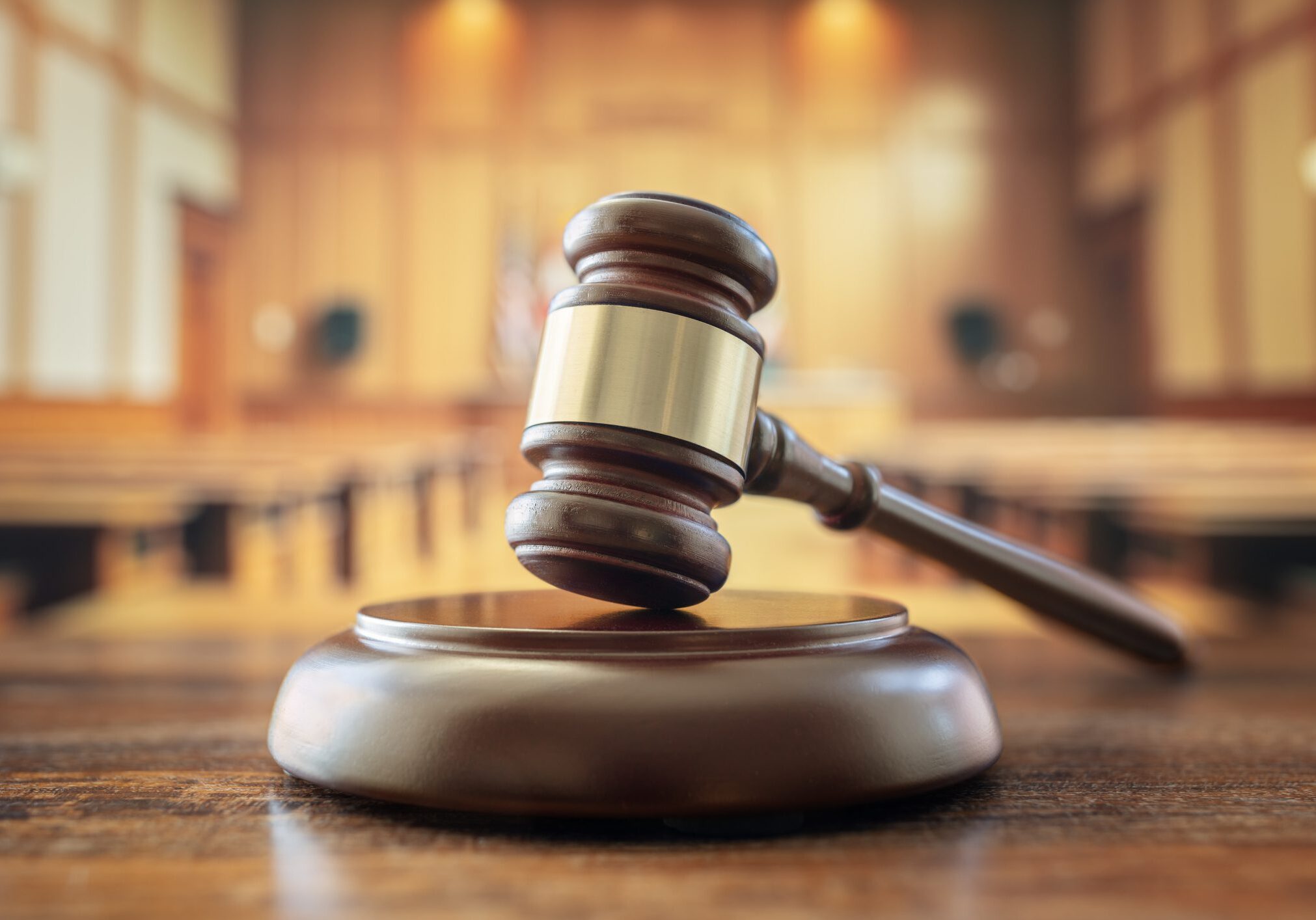 Judges gavel in court room legal trial and law background